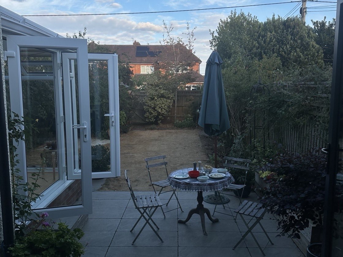 Dinner laid out on the garden table at my dad's, early evening